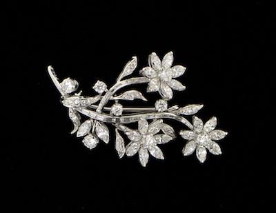 Appraisal: A Platinum and Diamond Flower Brooch Platinum mounted diamond brooch