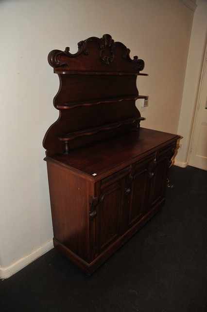 Appraisal: A VICTORIAN SIDEBOARD WITH THREE DRAWERS