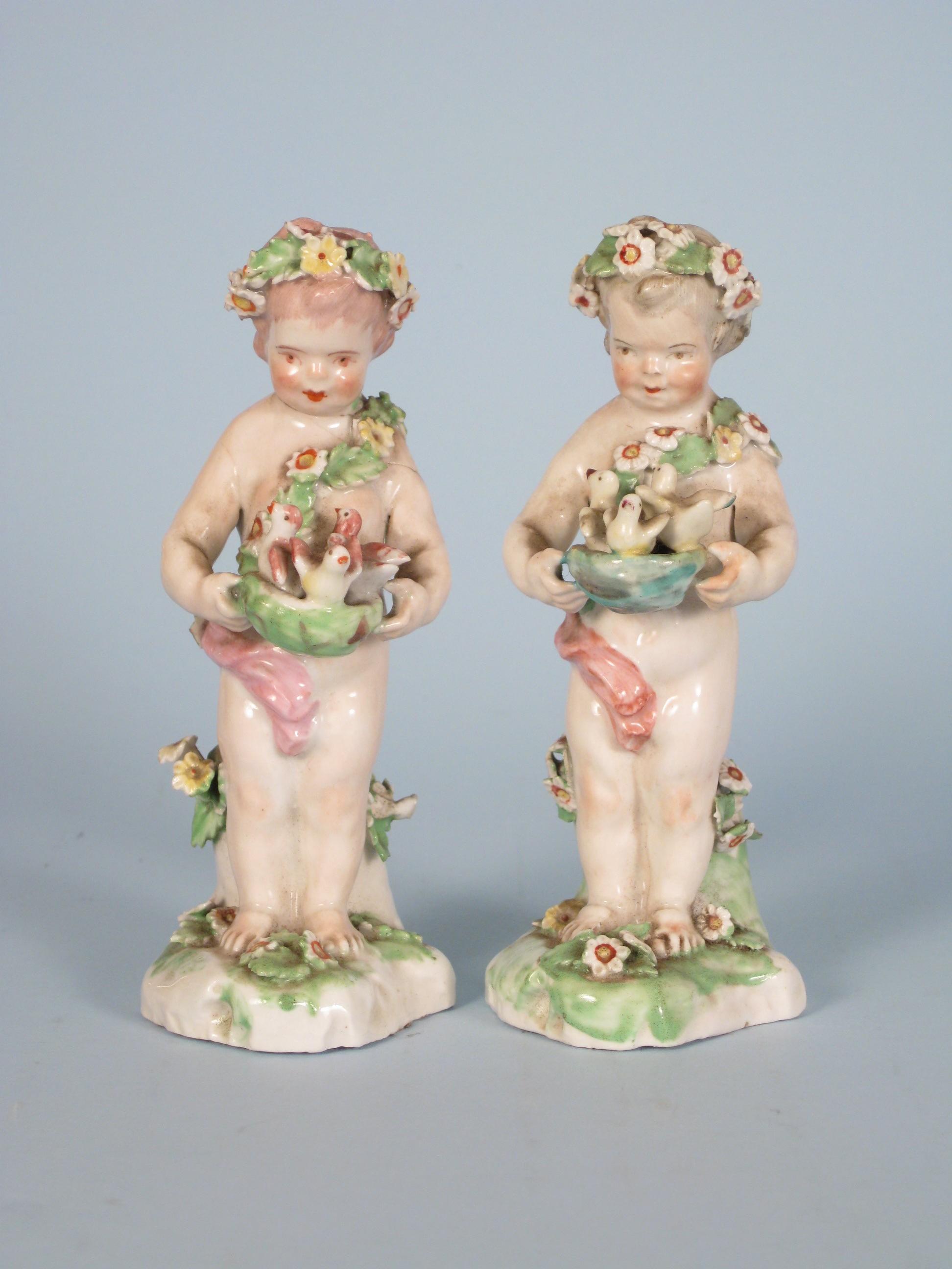 Appraisal: Pair of early Derby Figures of Putto with baskets of