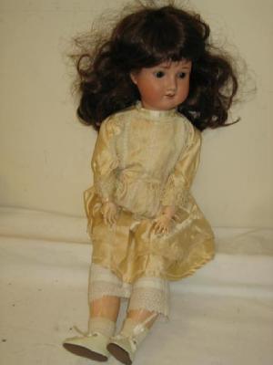 Appraisal: A Welsch Co bisque head girl doll with brown glass