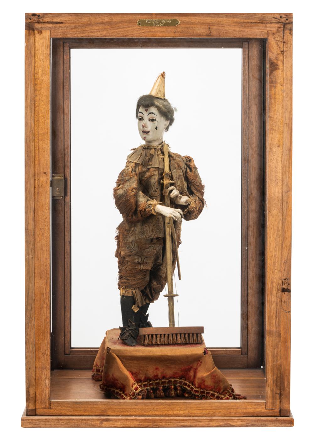 Appraisal: THE COURT JESTER AUTOMATONin a glazed wooden case with plaque