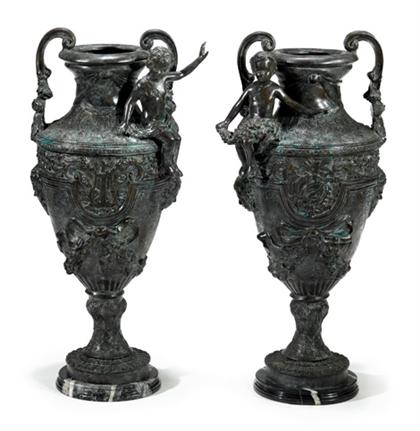 Appraisal: Pair of large patinated metal floor urns Each with foliate