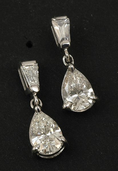 Appraisal: A pair of diamond drop earrings Each earring set with