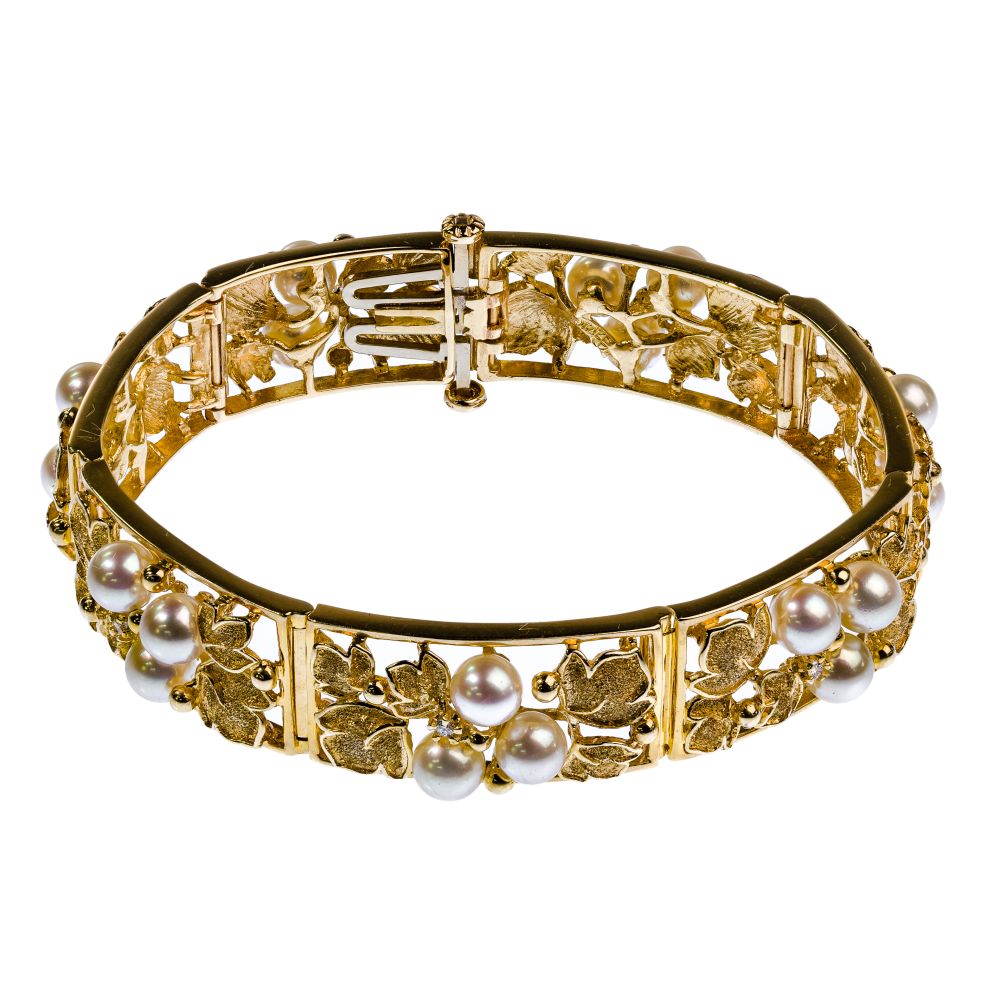 Appraisal: K YELLOW GOLD PEARL AND DIAMOND BRACELETHaving an openwork floral