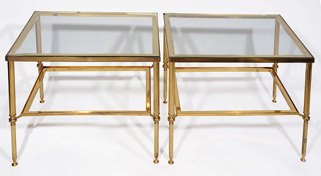 Appraisal: A PAIR OF RECTANGULAR BRASS OCCASIONAL TABLES standing on fluted