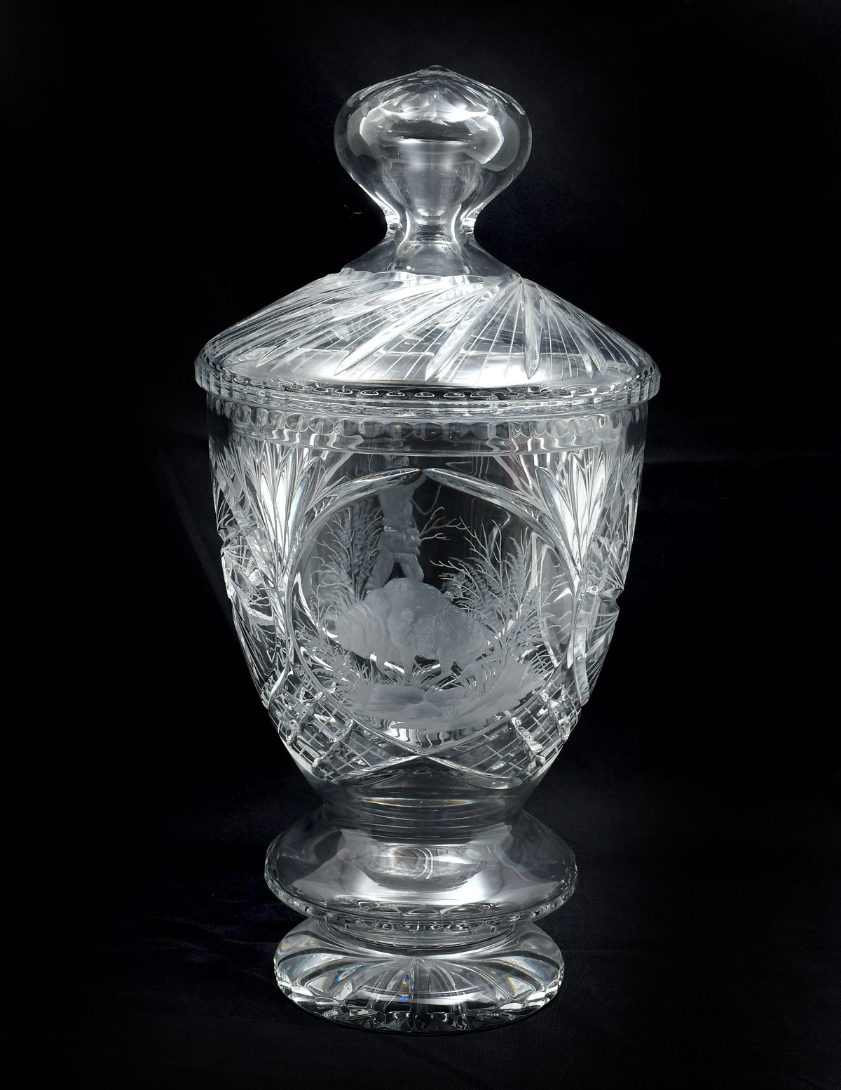 Appraisal: HEAVY CARVED CRYSTAL JAR Tall cut etched crystal lidded jar