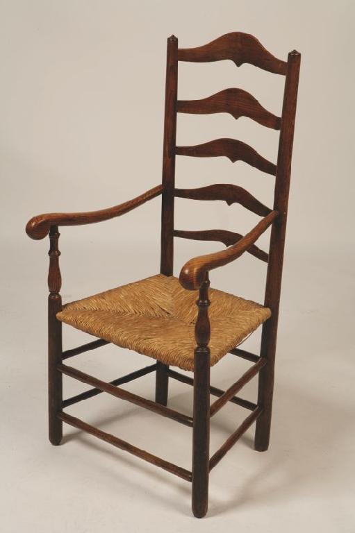 Appraisal: A LADDER BACK ARMCHAIR the tall back with five graduated