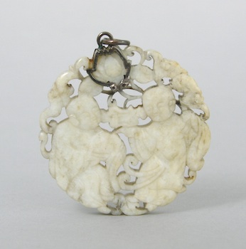 Appraisal: A Carved White Jade Disc of Two Figures A carved