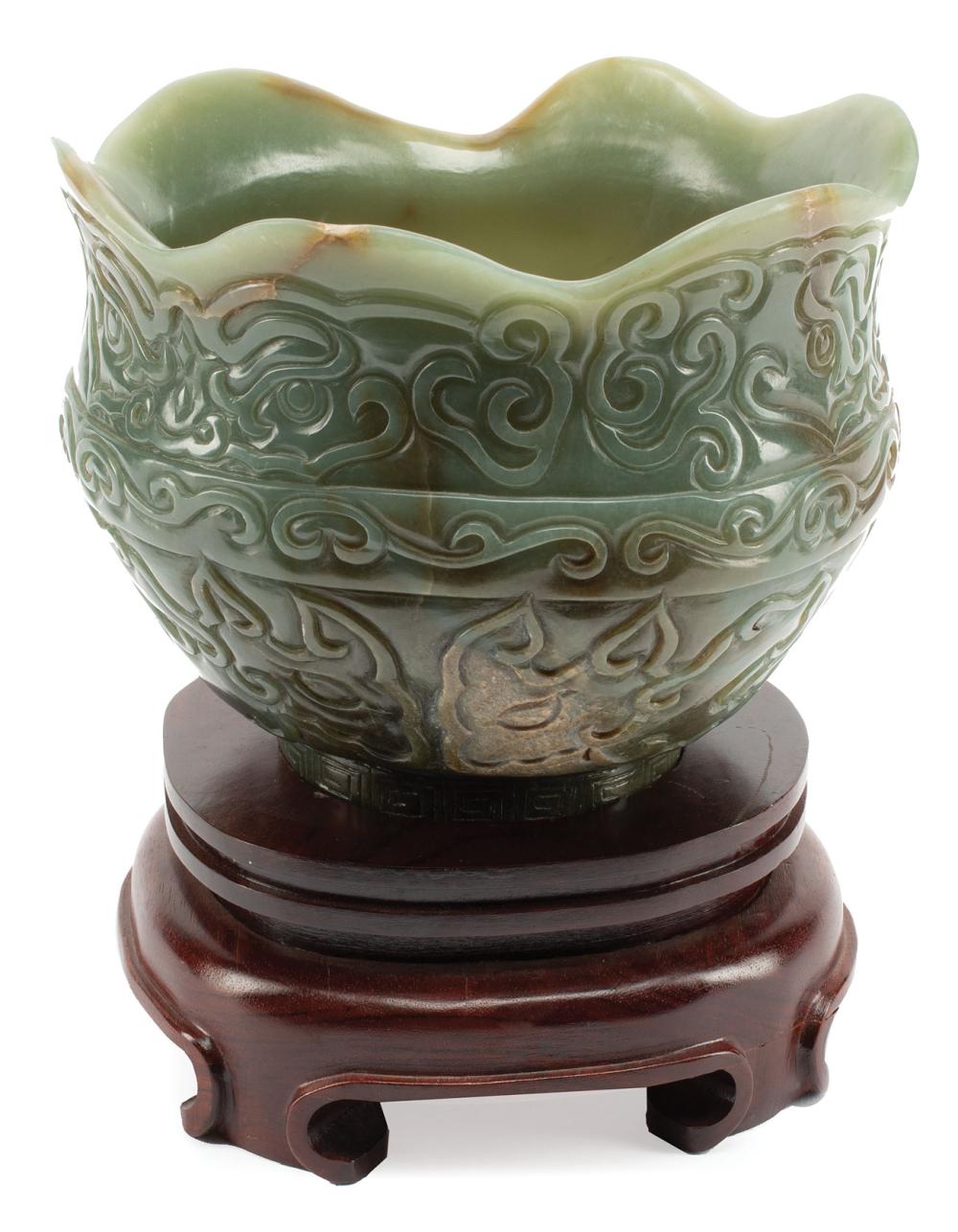 Appraisal: Chinese Celadon and Russet Jade Bowl petal lobed rim carved