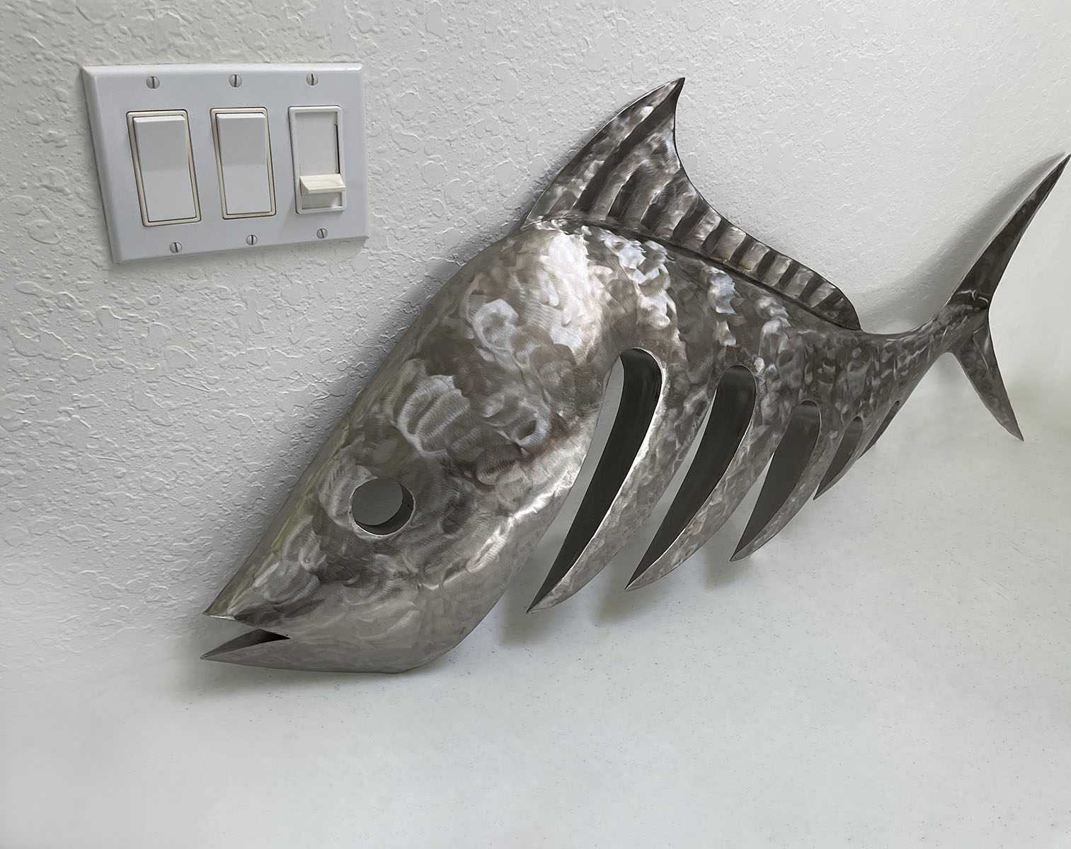 Appraisal: STUART PETERMAN LARGE STAINLESS STEEL FOSSIL FISH SCULPTURE ''h X