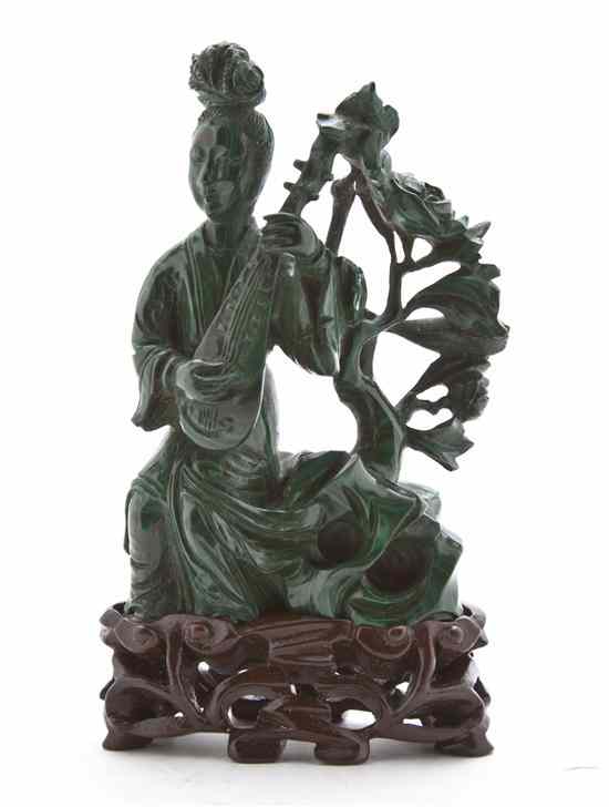 Appraisal: A Chinese Malachite Carving of a Musician depicting a female