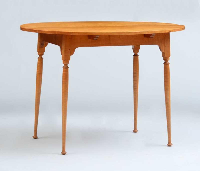 Appraisal: REPRODUCTION QUEEN ANNE FIGURED MAPLE TEA TABLE x x in