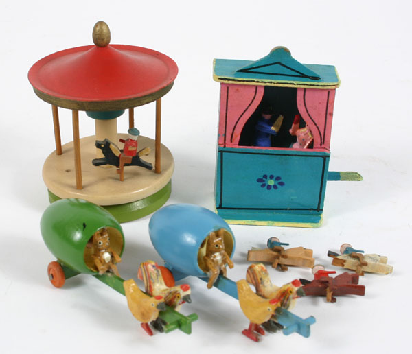 Appraisal: German Erzgebirge wooden toys four mechanical pieces including two bunny