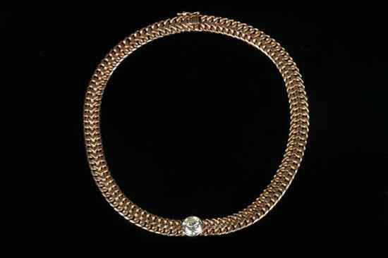 Appraisal: K YELLOW GOLD AND DIAMOND FLEXIBLE-LINK CHOKER Heavy strap of