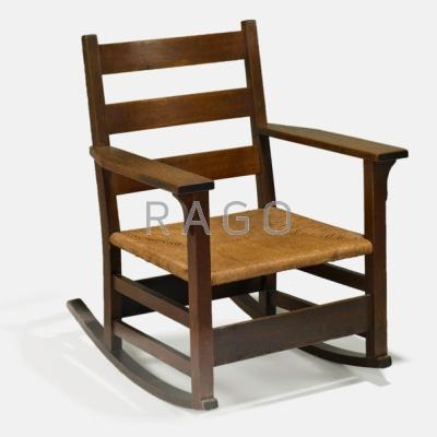 Appraisal: GUSTAV STICKLEY Rocking chair USA ca Quartersawn oak and woven