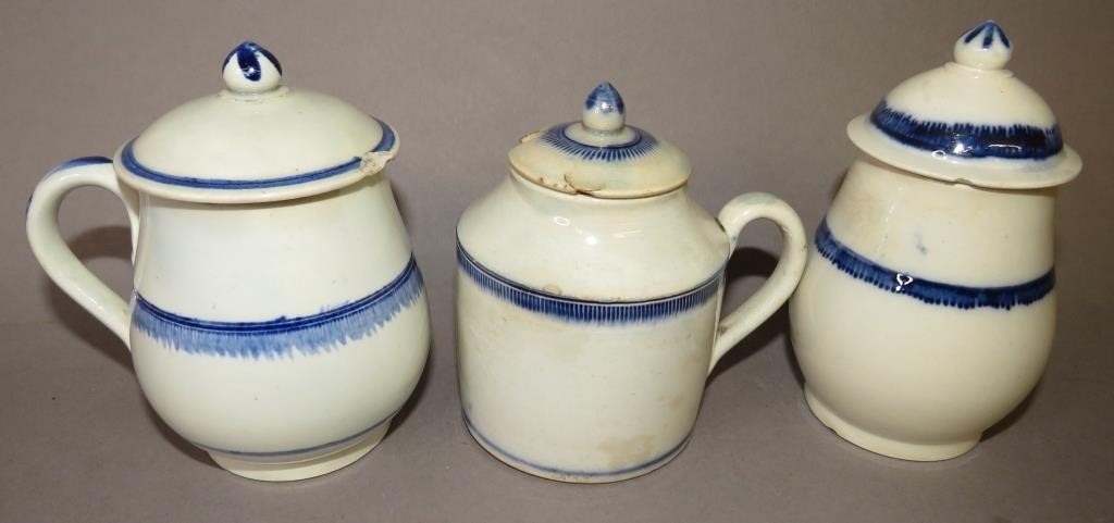 Appraisal: BLUE EDGED COVERED PEARLWARE CRUETSca three blue edged covered pearlware