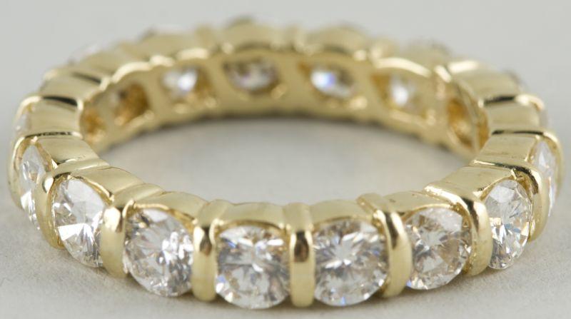 Appraisal: KT Yellow Gold and Diamond Eternity Wedding Band with bar