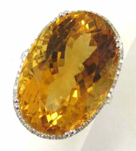 Appraisal: CITRINE DIAMOND AND FOURTEEN KARAT GOLD RING with round-cut diamonds