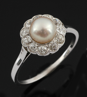 Appraisal: A pearl and diamond cluster ring Circa The natural pearl