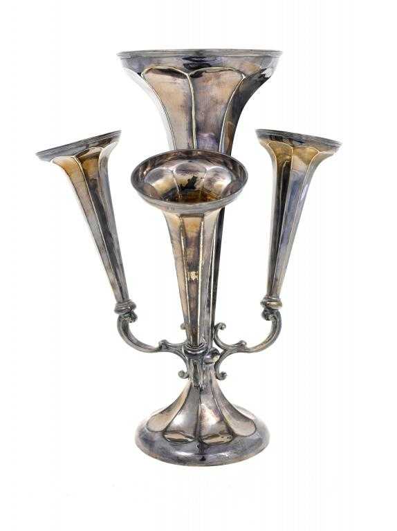 Appraisal: A GEORGE V CENTREPIECE of four faceted trumpet shaped vases