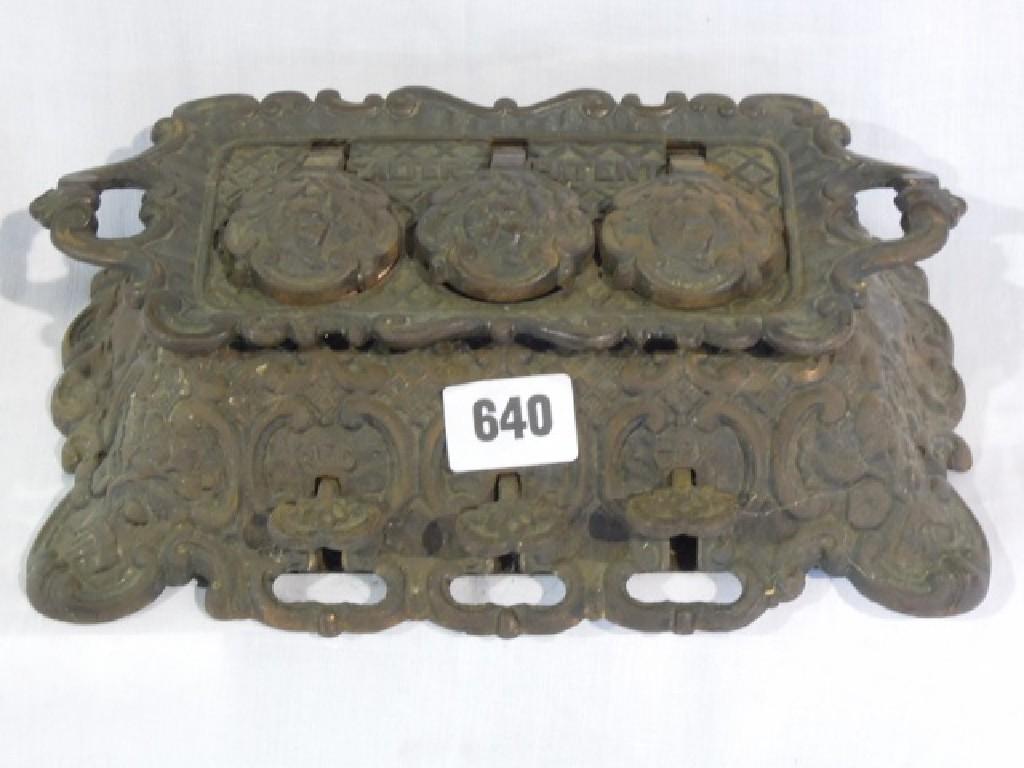 Appraisal: A cast iron inkwell with three pedals marked red black