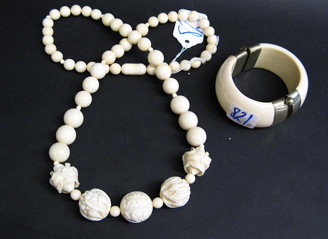 Appraisal: IVORY BEADED NECKLACE AND BRACELET The necklace having graduating round