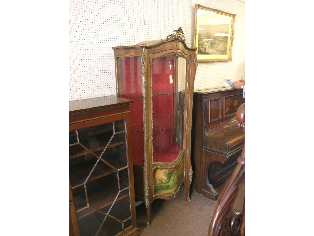 Appraisal: A Louis XV-style mahogany vitrine with elaborate ormolu mounts single