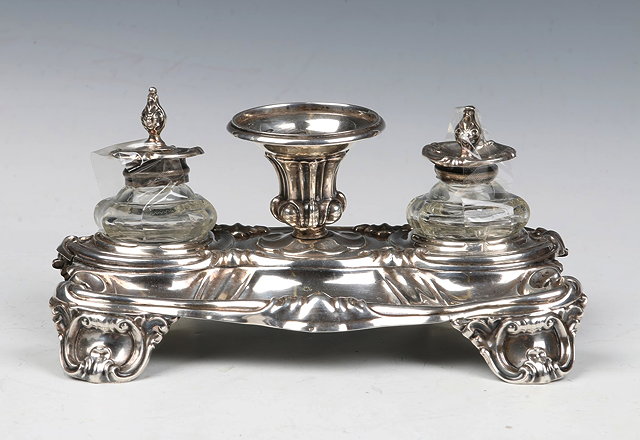 Appraisal: AN AUSTRO-HUNGARIAN SILVER DESK STAND with pressed scroll decoration and