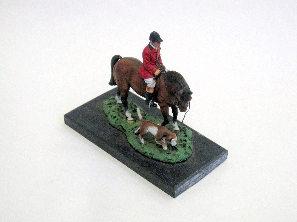 Appraisal: Small painted bronze figure of a huntsman on horse with