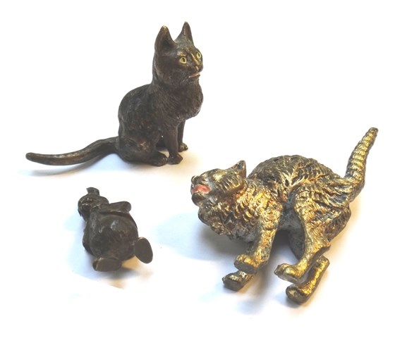 Appraisal: An Austrian gilt bronze and painted miniature cat in 'startled'