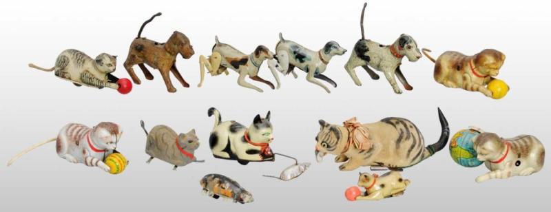 Appraisal: Lot of Tin Cat Dog Toys Description German Working Includes