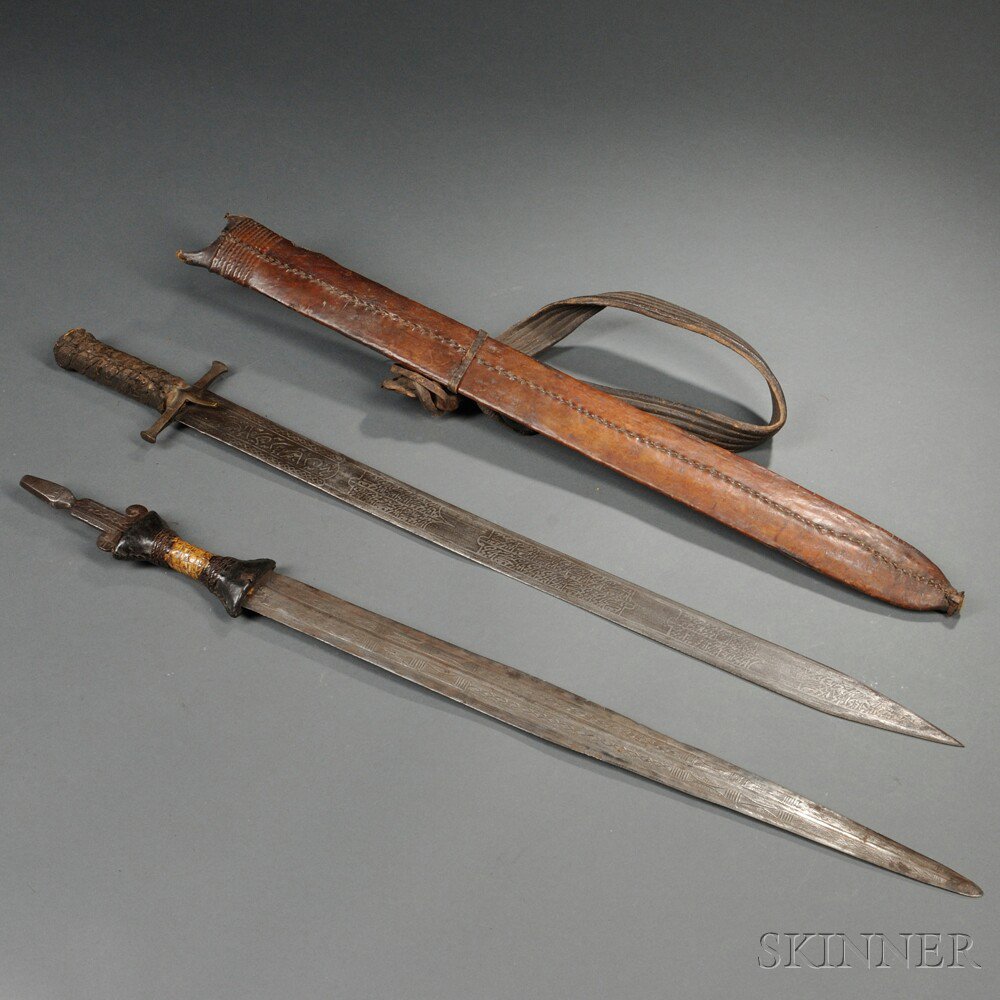 Appraisal: Two North African Swords both with crocodile skin grips one