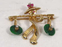 Appraisal: A carat gold ruby diamond and jade brooch in the