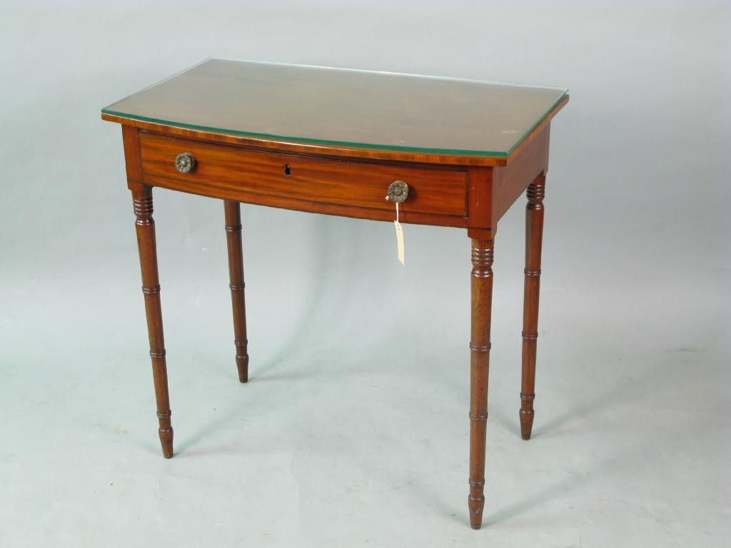 Appraisal: An early Victorian bow-fronted mahogany side table with single oak-lined