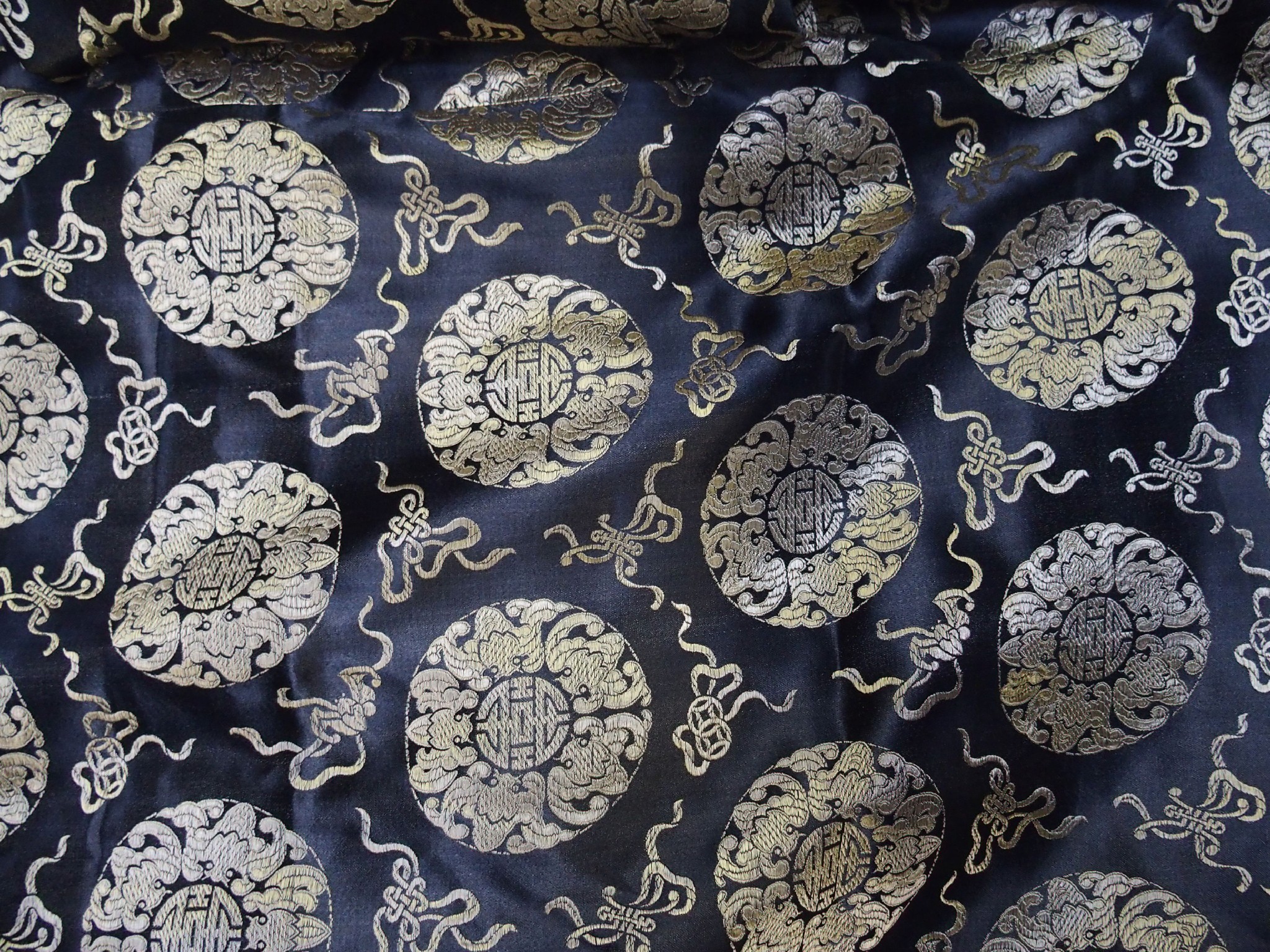 Appraisal: Chinese black and gold silk curtain