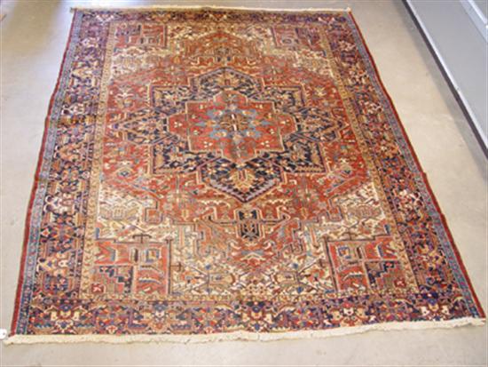 Appraisal: Semi-Antique Heriz Oriental Rug Central medallion Soft brick red blue