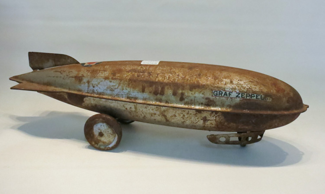 Appraisal: J C PENNEY LITTLE JIM GRAF ZEPPELIN PULL TOY pressed