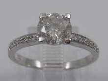 Appraisal: A white metal tests ct gold diamond solitaire ring with