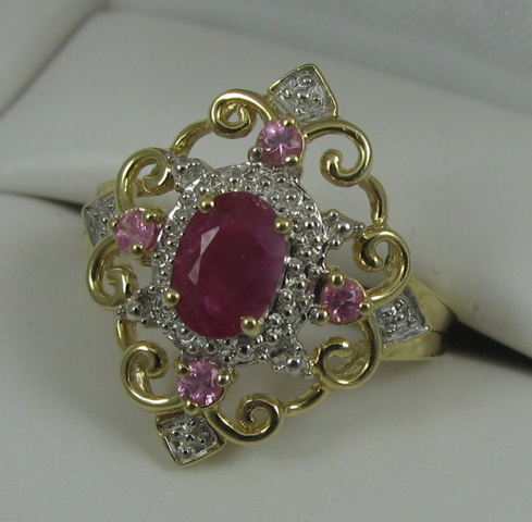 Appraisal: RUBY PINK SAPPHIRE AND FOURTEEN KARAT GOLD RING with appraisal