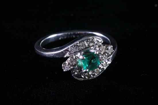 Appraisal: K WHITE GOLD AND DIAMOND RING Square-cut emerald surrounded by