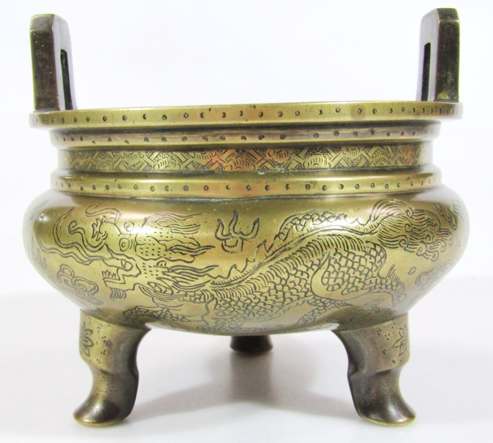 Appraisal: A Chinese bronze censer the circular bombe body engraved with