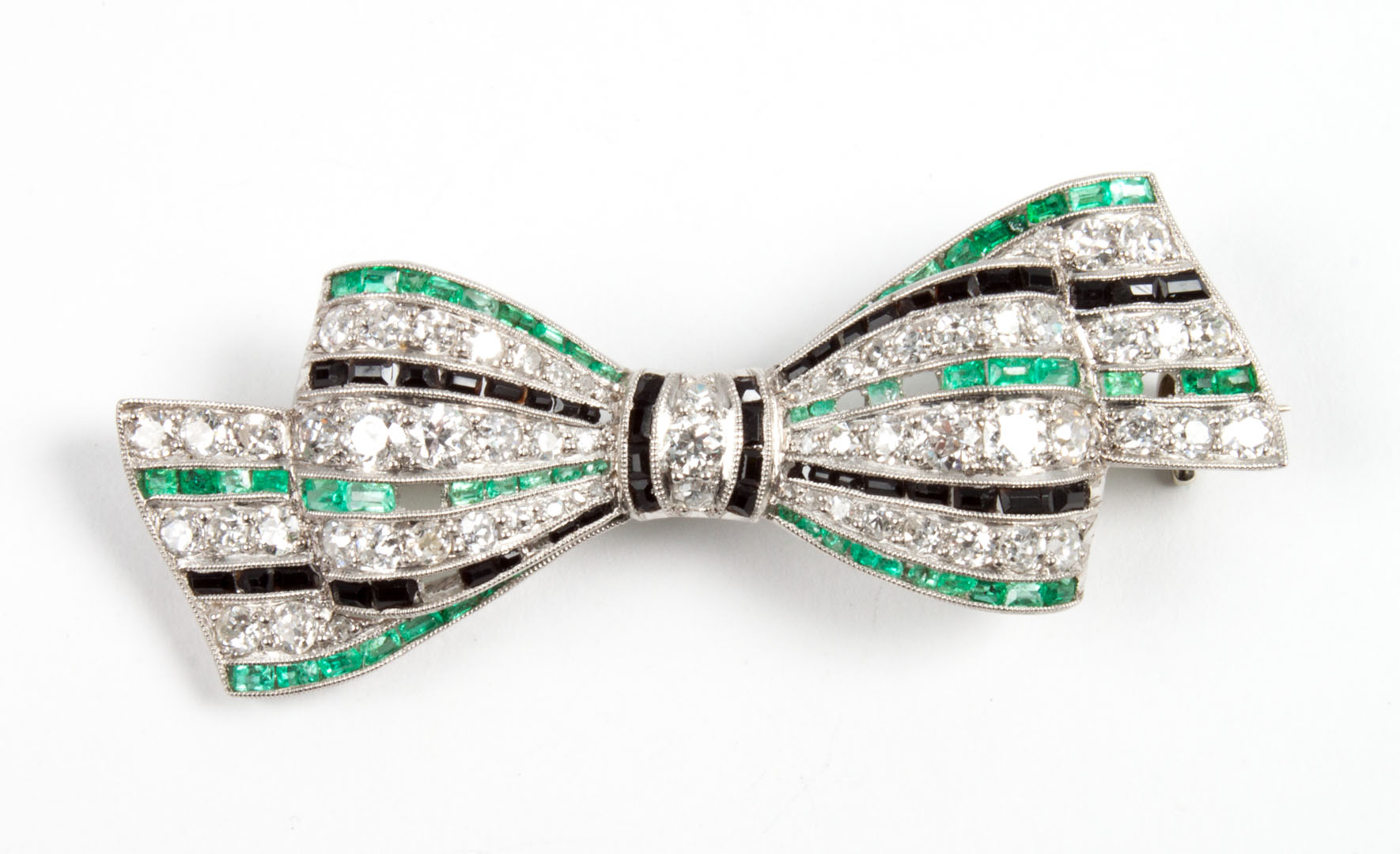 Appraisal: Platinum diamond emerald black stone brooch in W grams