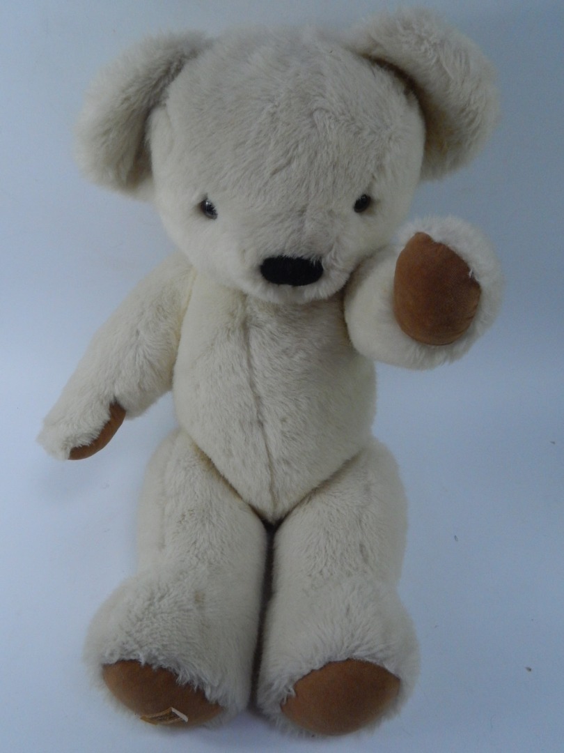 Appraisal: A Merrythought light fur teddy bear with fabric patches cm