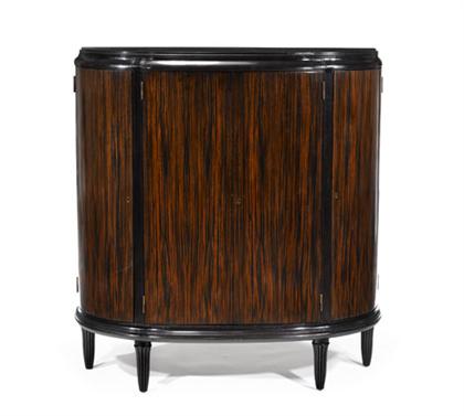 Appraisal: UNKNOWN late th century Cabinet Bowfront cabinet with zebra-wood veneer