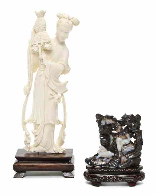 Appraisal: A Chinese Carved Ivory Figure depicting a woman standing with