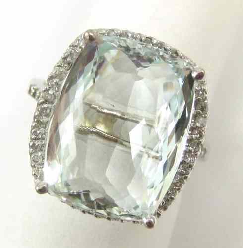 Appraisal: AQUAMARINE AND DIAMOND RING k white gold with round full-cut