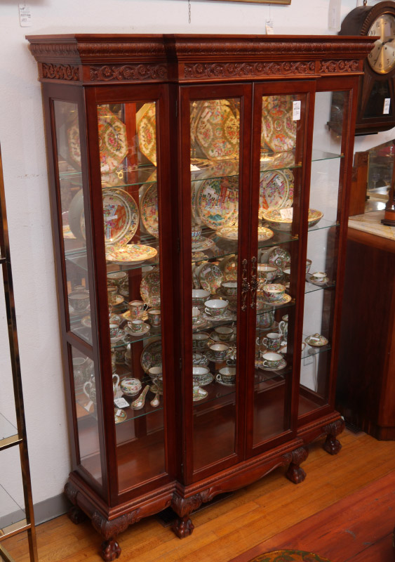 Appraisal: CARVED GLASS CURIO CABINET Carved stepped pediment with acanthus leaf