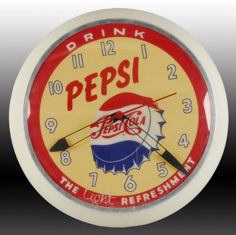 Appraisal: Pepsi Cola Dualite Light-Up Clock Description Circa s Plastic Face