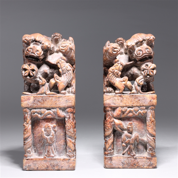 Appraisal: Pair of Chinese elaborately carved soapstone foo lion seals with