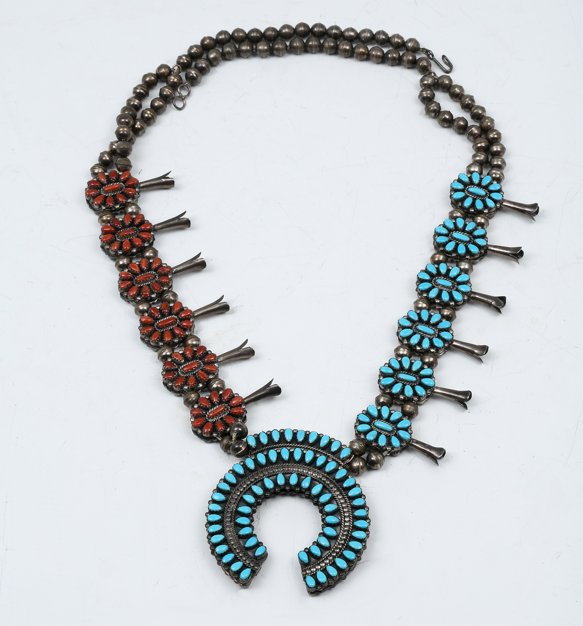 Appraisal: NATIVE AMERICAN REVERSIBLE TURQUOISE CORAL SQUASH BLOSSOM NECKLACE Turquoise on